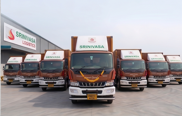 Lineup of Srinivasa Logistics branded trucks at the depot